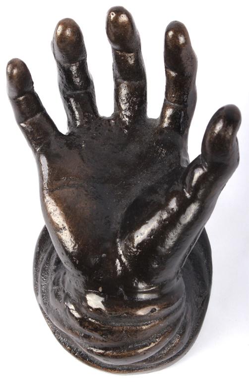 SOLID BRONZE HYPER REALISTIC HAND SCULPTURE: SOLID BRONZE HYPER REALISTIC HAND SCULPTURE Bronze sculpture of a human hand in 1:1 scale. Sculpture may be used as a key holder, ring holder, or cell phone stand. Hyper realistic. Made in China.Size:
