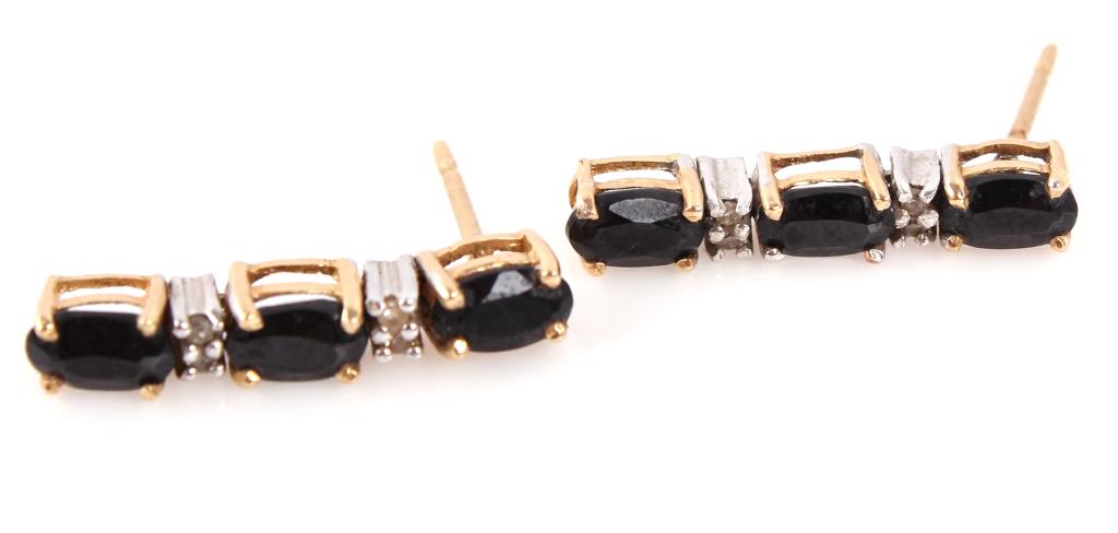 14K YELLOW GOLD DIAMOND & BLACK ONYX EARRINGS: 14K YELLOW GOLD DIAMOND & BLACK ONYX EARRINGS 14k yellow gold diamond and onyx earrings. Each earring has 4, .01ct diamonds. Weight: 1.9 Grams Size: .75" Condition: Very fine
