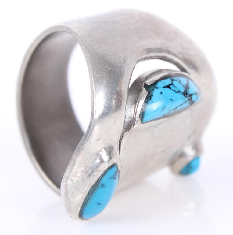 SCANDINAVIAN STERLING SILVER TURQUOISE RING: SCANDINAVIAN STERLING SILVER TURQUOISE RING Sterling silver ring in Scandinavian style with three inlaid turquoise gemstones. Weight: 11.1 Grams Condition: Very Fine.