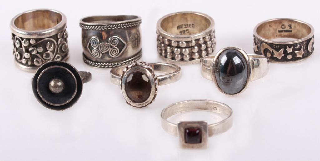 STERLING SILVER MEN'S AND WOMENS RINGS - LOT OF 8: STERLING SILVER MEN'S AND WOMENS RINGS - LOT OF 8 Sterling men's and women's rings - lot of 8. Includes 4 ladies rings with smokey quartz and hematite and 4 men's rings. Weight: 48.0 GramsSize: 4.5 -