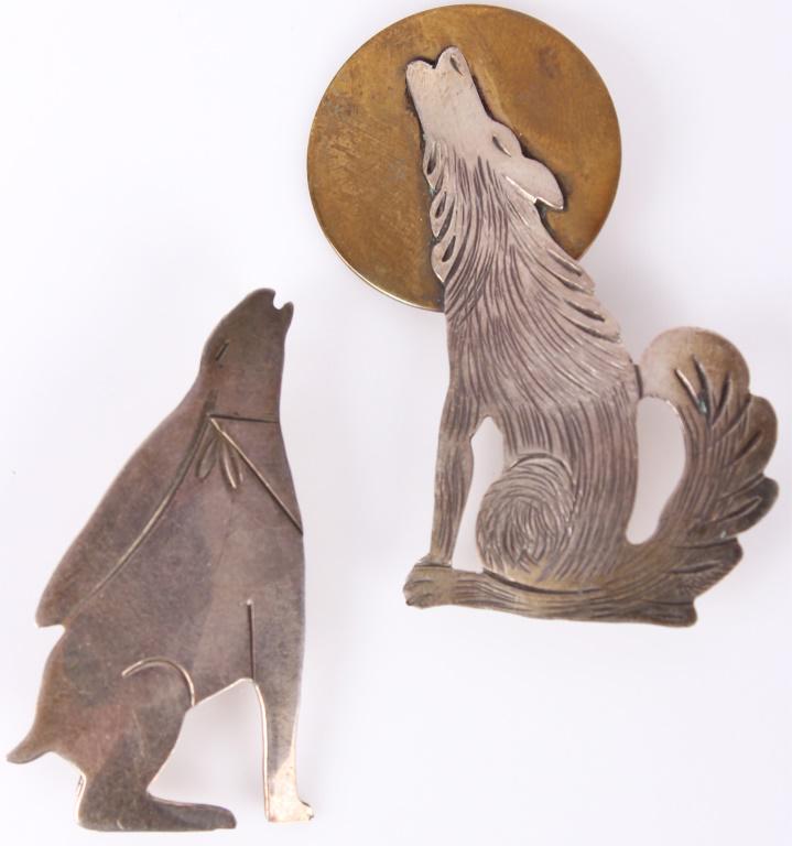 NAVAJO NATIVE AMERICAN STERLING BROOCH - LOT OF 2: NAVAJO NATIVE AMERICAN STERLING BROOCH - LOT OF 2 Navajo Native American, sterling silver, brooch pins. Lot of two to include one depicting a wolf howling at the moon and one depicting a jack rabbit. 