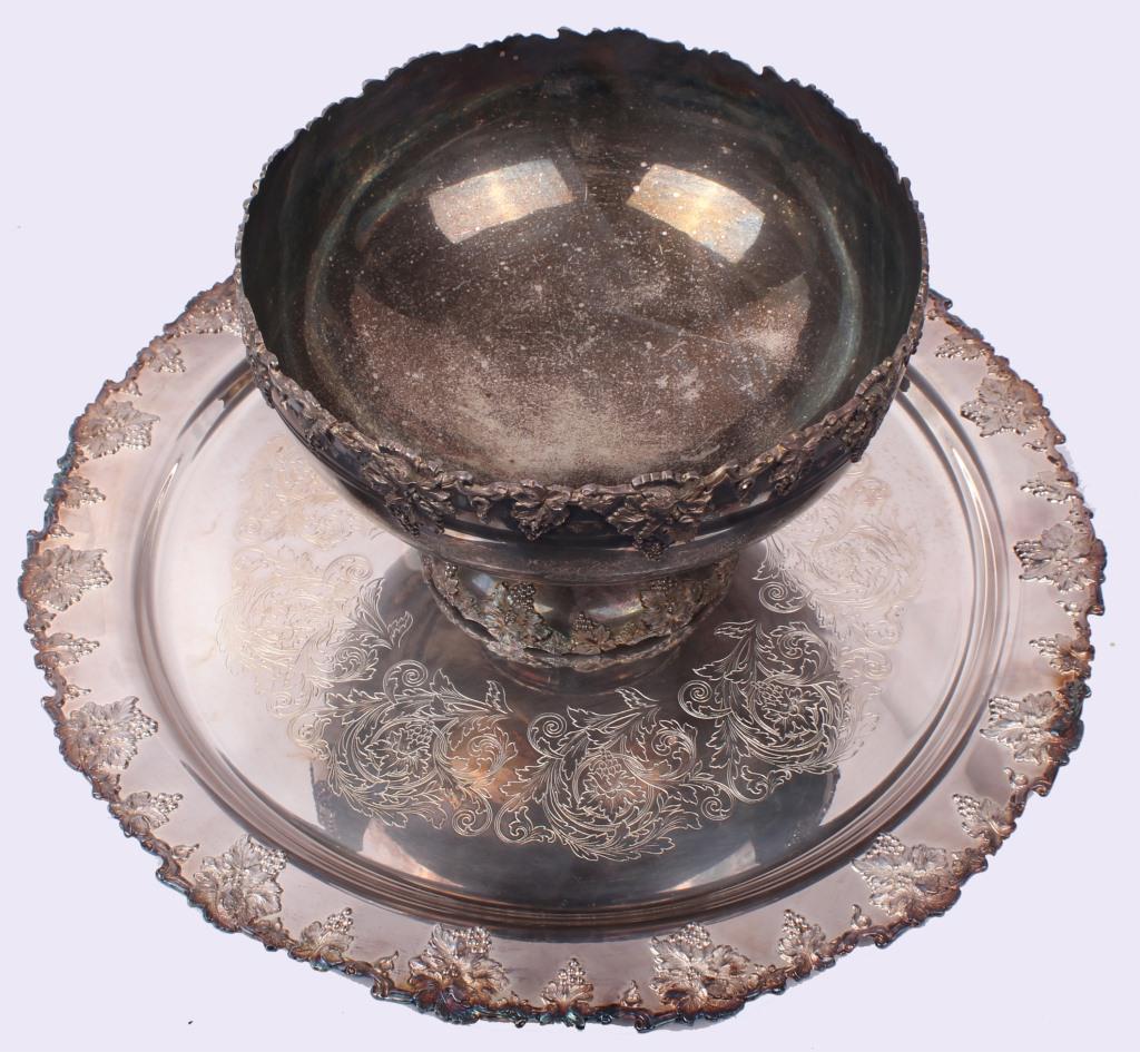 WEBSTER WILCOX VINTAGE STYLE PUNCH BOWL & PLATTER: WEBSTER WILCOX VINTAGE STYLE PUNCH BOWL & PLATTER Webster Wilcox ornate silver plate punch bowl and matching 22" round platter in the "Vintage" style. Size: 22" platter, 13" across bowlCondition: Wear