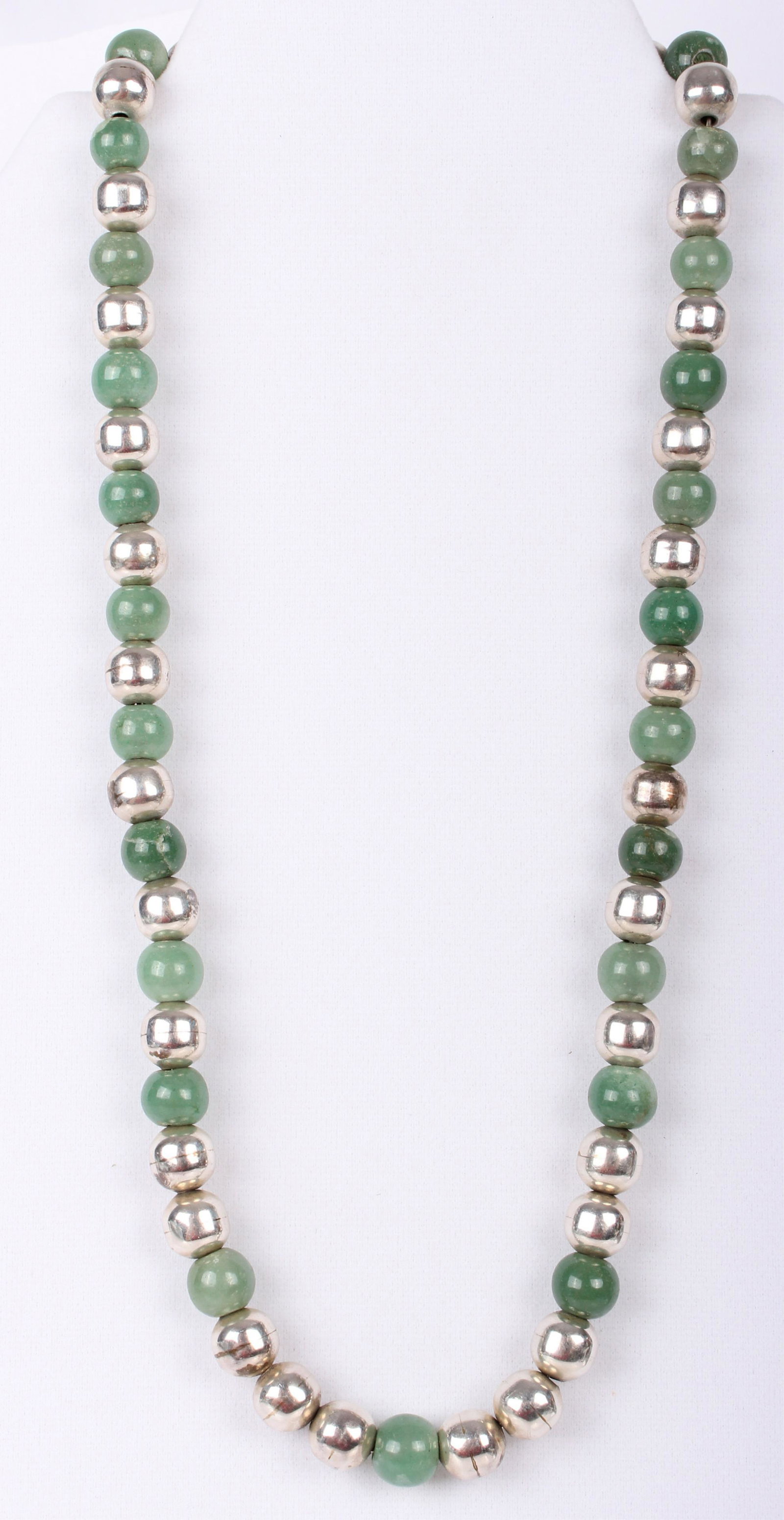 TAXCO MEXICAN SILVER AND JADE 21" LADIES NECKLACE: TAXCO MEXICAN SILVER AND JADE 21" LADIES NECKLACE Taxco Mexican Southwest silver and green jade beaded ladies necklace. Tested as jadeite. Mexican Weight: 78.2 Grams Size: 21"