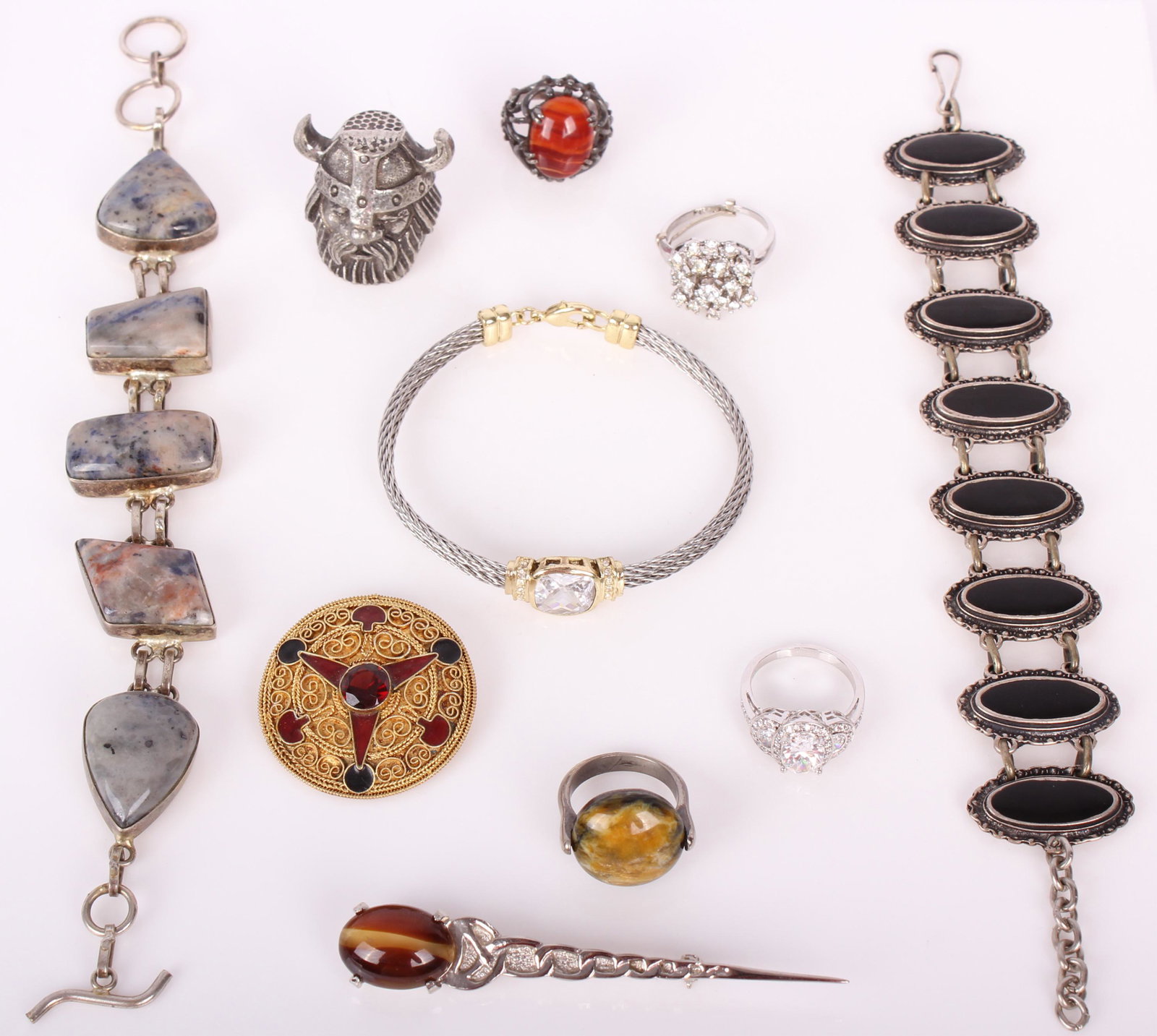 LADIES COSTUME JEWELRY - LOT OF 10: LADIES COSTUME JEWELRY - LOT OF 10 Ladies costume jewelry to include an onyx bracelet, a double linked stone bracelet, 4 rings, a rope bracelet, a Tinn Per Norway pewter thimble, a Scottish Brooch, an