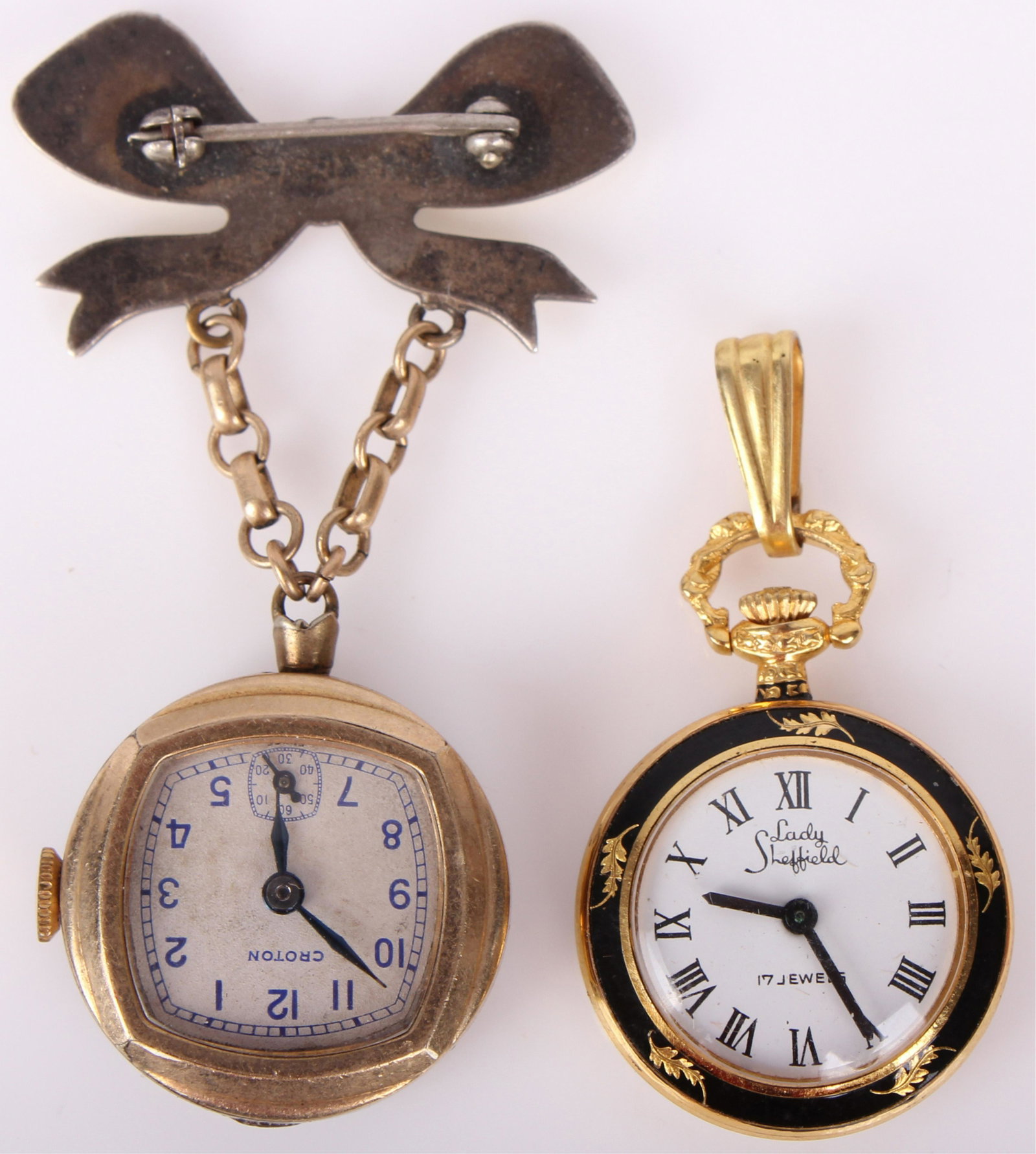 STERLING CROTON BROOCH WATCH LADY SHEFFIELD WATCH: STERLING CROTON BROOCH WATCH LADY SHEFFIELD WATCH Vintage Croton sterling enamel brooch pin pendant lapel watch and a Lady Sheffield 17 jewel watch pendant. Size: 2" Croton