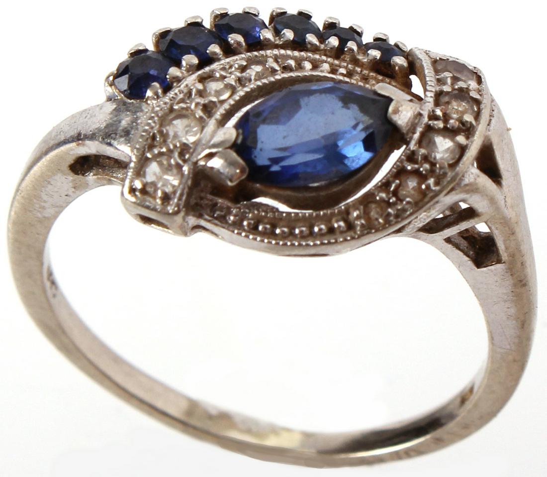 14K WHITE GOLD BLUE SAPPHIRE DIAMOND VINTAGE RING: 9701714K WHITE GOLD BLUE SAPPHIRE DIAMOND VINTAGE RING 14k white gold blue sapphire and diamond ladies ring with a .35ct marquise sapphire surrounded by six graduating size sapphires and ten graduatin