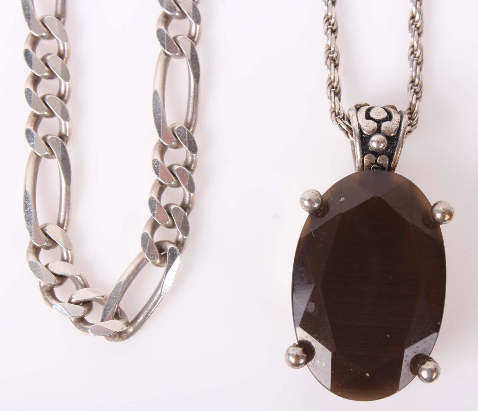 STERLING SILVER NECKLACES - CHAIN & TIGERS EYE: 97095STERLING SILVER NECKLACES - CHAIN & TIGERS EYE Sterling silver chain link necklace and sterling twisted rope necklace with 1.5" tigers eye pendant. Weight: 52.5 grams Size: 18 to 22"