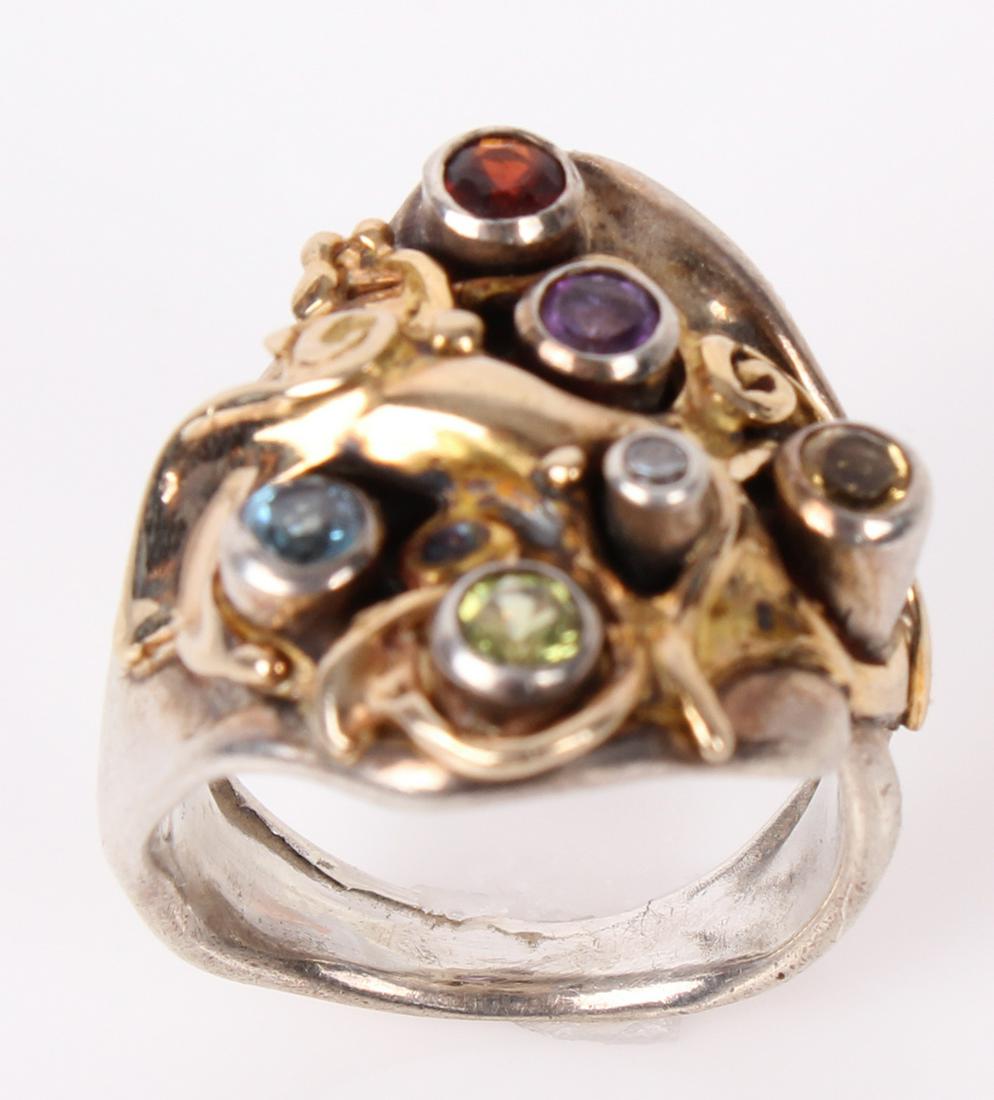 STERLING SILVER AND 14K ACCENTED FASHION RING: 97105STERLING SILVER AND 14K ACCENTED FASHION RING Sterling silver and 14k yellow gold ladies colored stone ring, varied stones. Weight: 9.5 grams