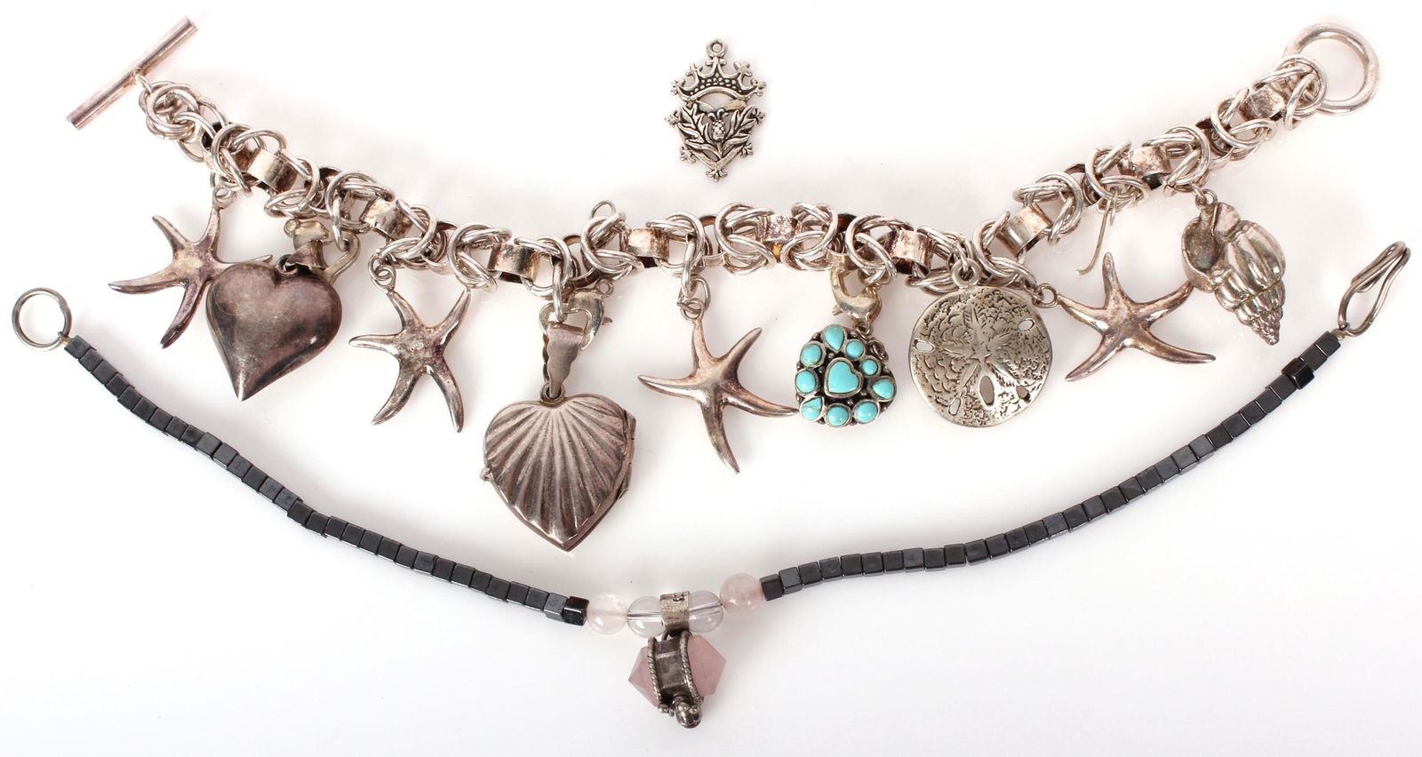 STERLING SILVER BRACELETS & PENDANT - LOT OF 3: 97108STERLING SILVER BRACELETS & PENDANT - LOT OF 3 Sterling silver bracelets and pendant to include one sterling beach theme charm bracelet, one hematite beaded sterling pendant bracelet, and one Bri