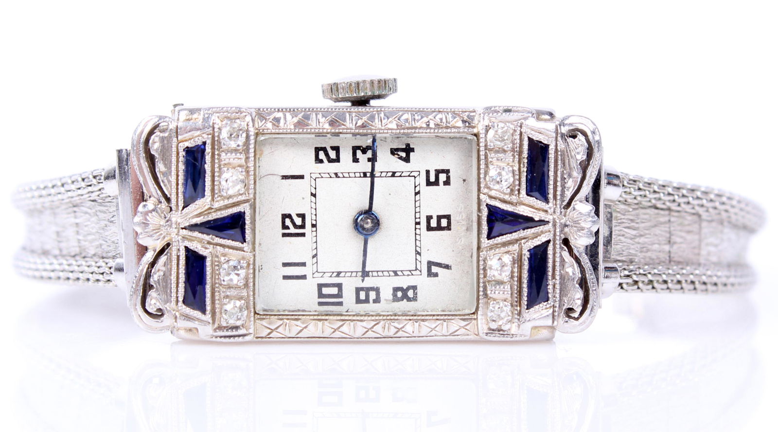 ANTIQUE LADIES 18K WHITE GOLD PAINTO WRIST WATCH: 97183ANTIQUE LADIES 18K WHITE GOLD PAINTO WRIST WATCH Ladies 18k white gold diamond and sapphire set case Painto Watch Company wristwatch. 16 jewel wristwatch in 18k Bruner intricate case, featuring s