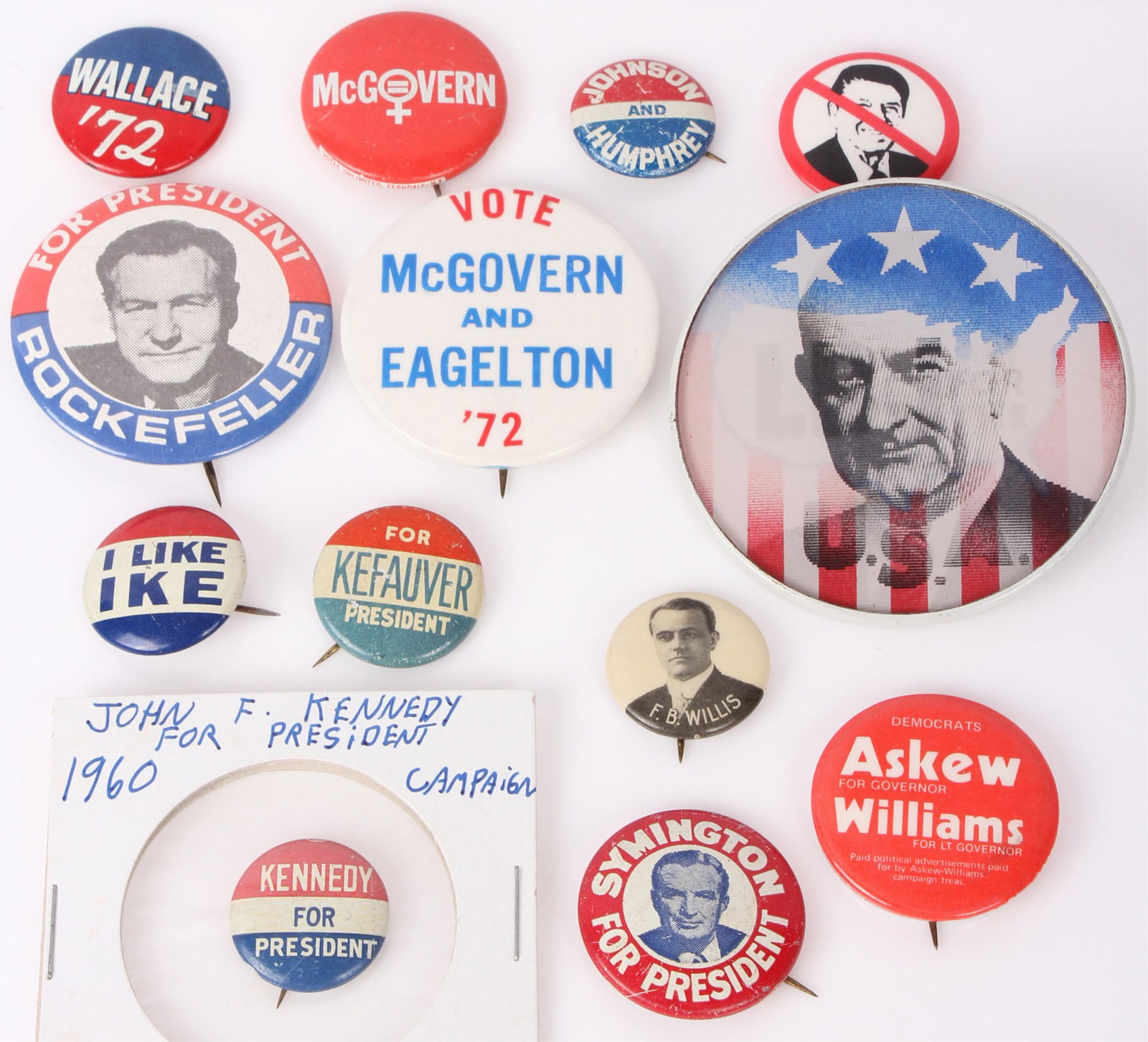 VINTAGE POLITICAL CAMPAIGN BUTTONS - LOT OF 13: 97203VINTAGE POLITICAL CAMPAIGN BUTTONS - LOT OF 13 Vintage political campaign buttons to include one 1964 LBJ flasher button, one 1984 anti Reagan button, I Like Ike, Symington for President, Wallace