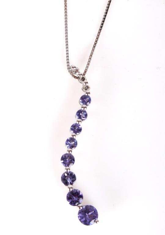 LADIES 14K WHITE GOLD DIAMOND TANZANITE NECKLACE: LADIES 14K WHITE GOLD DIAMOND TANZANITE NECKLACE Ladies 14k white gold diamond and tanzanite necklace. A cascade of diamonds and tanzanite round cut stones, ranging from 1 to 4mm. Box link chain. Weig