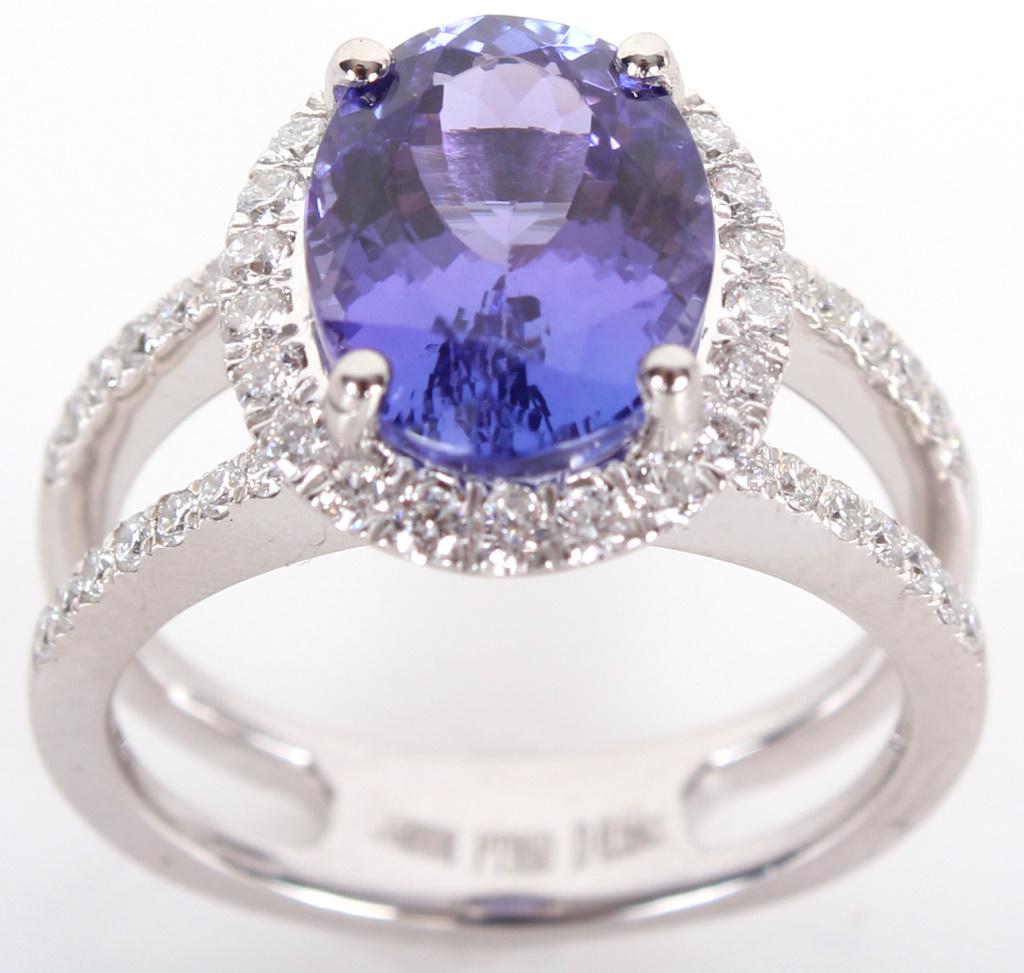 LADIES PLATINUM DIAMOND 4.05CT TANZANITE RING: LADIES PLATINUM DIAMOND 4.05CT TANZANITE RING Ladies platinum diamond 4.05ct oval cut tanzanite ring with excellent cut violet blue color and fifty .59ctw brilliant round diamonds VS2-SI2 and G-H colo