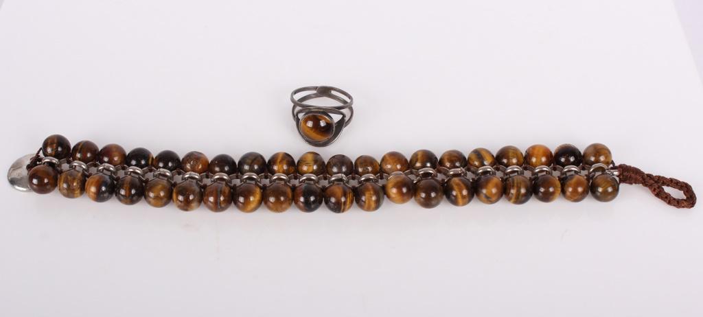 STERLING SILVER TIGERS EYER BRACELETS & RING: STERLING SILVER TIGERS EYER BRACELETS & RING Ladies sterling silver tigers eye stone ring signed Israel, and a beaded silver tone bracelet with tigers eye and agate stones. Weight: 23.3 grams total Si