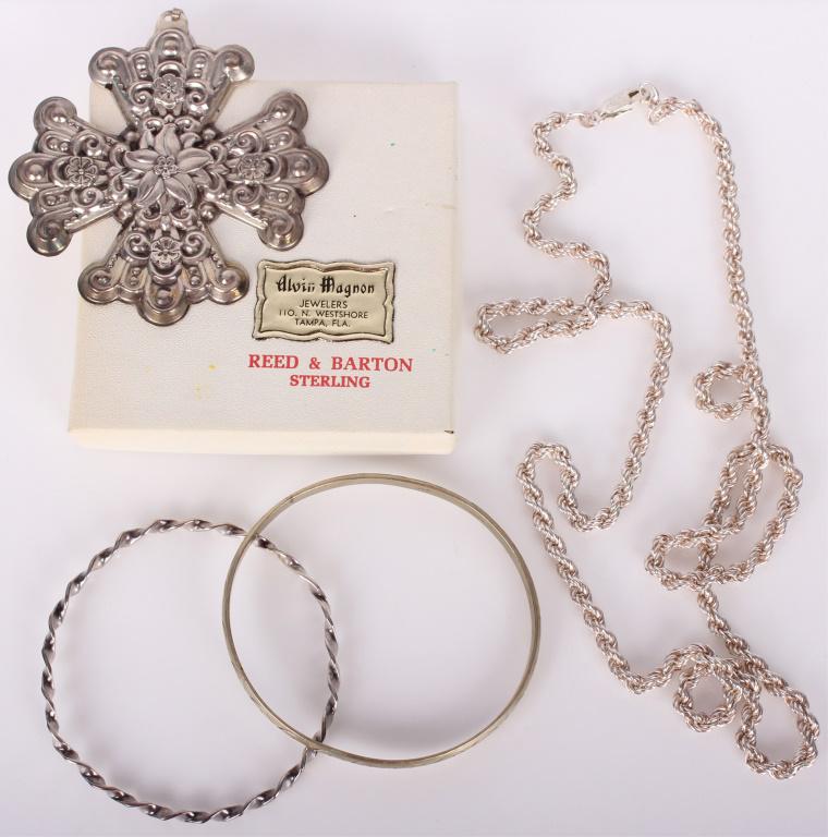 STERLING SILVER ASSORTED JEWELRY - LOT OF 3: STERLING SILVER ASSORTED JEWELRY - LOT OF 3 Sterling silver assorted jewelry - lot of 3 to include one sterling silver necklace, one sterling silver 1974 Christmas cross by Reed and Barton silver, and