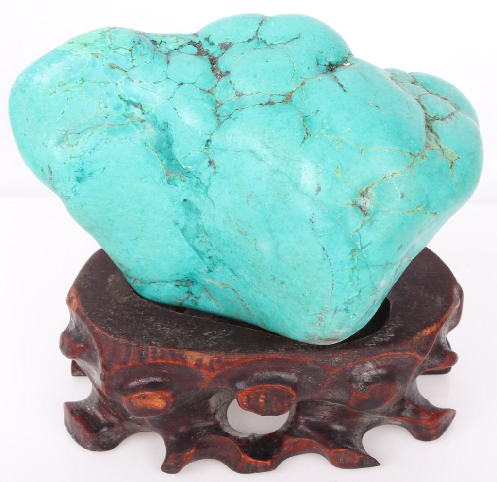 CHINESE CARVED TURQUOISE SCULPTURE & DISPLAY BASE: CHINESE CARVED TURQUOISE SCULPTURE & DISPLAY BASE Carved turquoise stone sculpture & display base. Turquoise weighs 658.7 grams. Size: 5 X 5 X 2" Condition: Wear commensurate with age