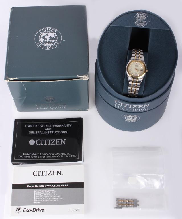 CITIZEN ECO-DRIVE LADIES WRISTWATCH MODEL E011: CITIZEN ECO-DRIVE LADIES WRISTWATCH MODEL E011 Citizen Eco-Drive ladies gold and silver-toned wristwatch, model E011. Water-resistant to 100 meters. Includes original box, paperwork, and extra links. 