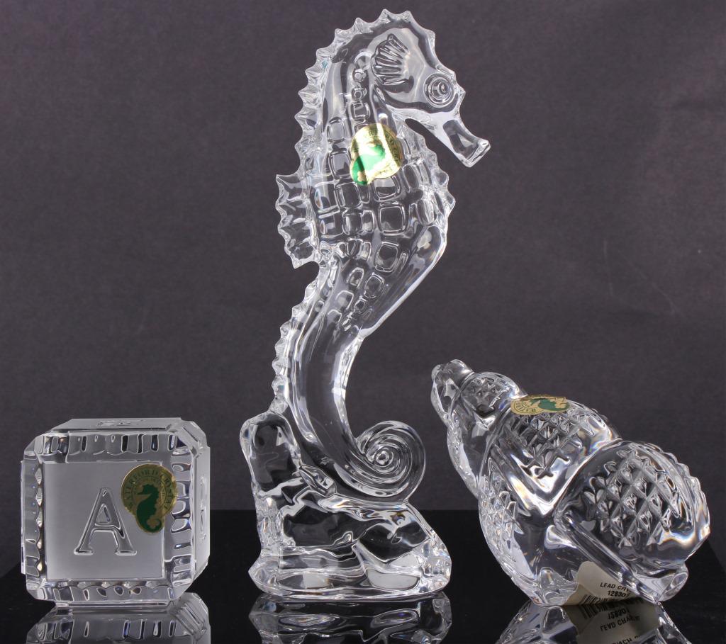 WATERFORD CRYSTAL SCULPTURE - SHELL, BLOCK, ETC: WATERFORD CRYSTAL SCULPTURE - SHELL, BLOCK, ETC Waterford crystal sculptures to include one Cape Collection 7.5" Seahorse, one conch shell, and one Baby alphabet block lead crystal sculpture. Size: Ta