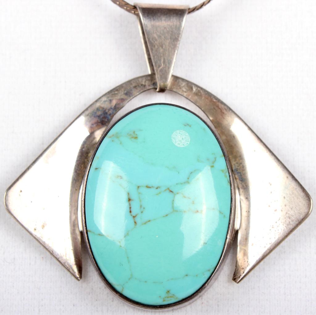 MEXICAN STERLING SILVER TURQUOISE PENDANT NECKLACE: MEXICAN STERLING SILVER TURQUOISE PENDANT NECKLACE Mexican sterling silver turquoise pendant necklace. Chain is made of Italian sterling silver and the clasp is marked JC. The pendant is Mexican sterl