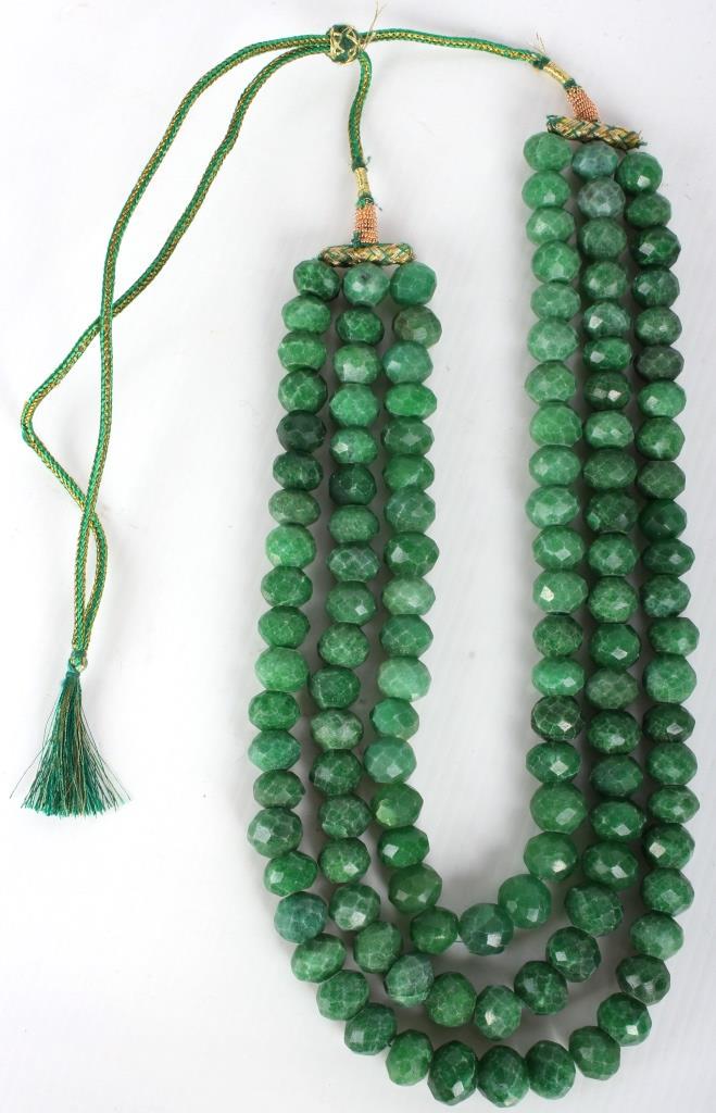 GREEN JADEITE BEADED NECKLACE - 1555 CTW: GREEN JADEITE BEADED NECKLACE - 1555 CTW Green jadeite beaded necklace with 1555 ctw. Has adjustable knot for neck and 3 strands of beads. Weight: 413.3 Grams Size: 13.3 mm beads, 46" Condition: Very 