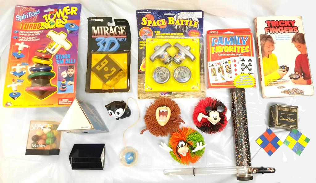 ASSORTED 1980'S AND 1990'S TOYS - LOT OF 15: ASSORTED 1980'S AND 1990'S TOYS - LOT OF 15 Assorted toys from the 1980's and 1990's to include Tricky Fingers (Tiger Games 1989), Tower Tops ( Agglo, 1999), a Tedco Miracle 3D puzzle (1989), Hoyle Fa