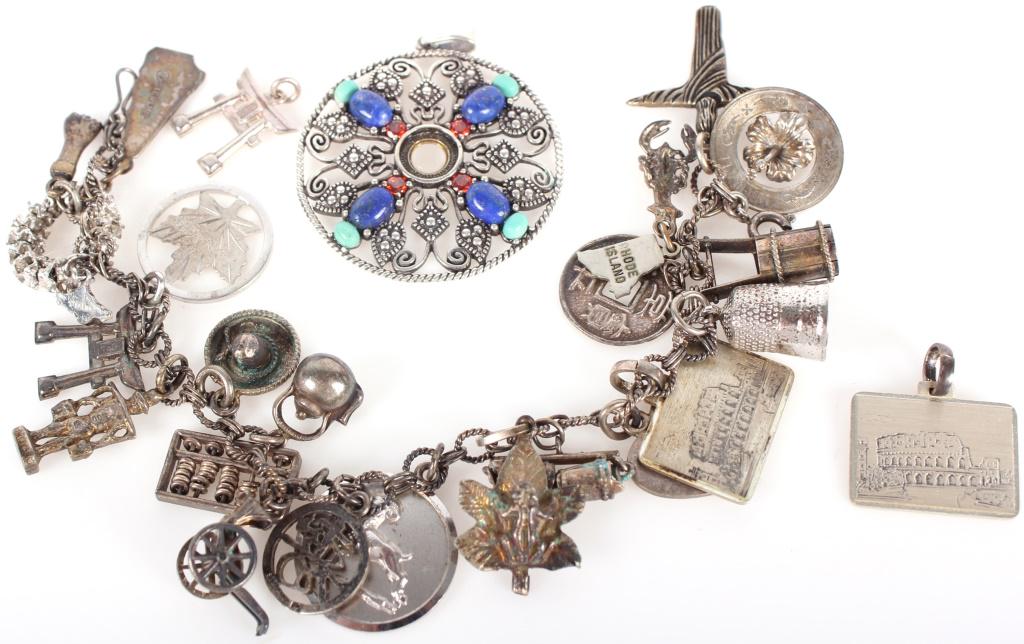 STERLING SILVER LADIES CHARM BRACELET & PENDANT: 10098STERLING SILVER LADIES CHARM BRACELET & PENDANT Sterling silver ladies charm bracelet and pendant. Bracelet includes multiple Asian charms, a Canadian charm, and a charm of Jesus. Comes with 2 un