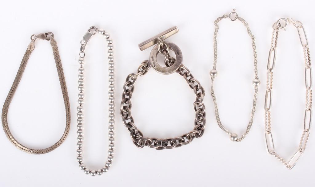 LADIES STERLING SILVER BRACELETS - LOT OF 5: 10101LADIES STERLING SILVER BRACELETS - LOT OF 5 Lot of five ladies sterling silver bracelets, varied styles. Weight: 45.8 gramsWe Can Ship This Item