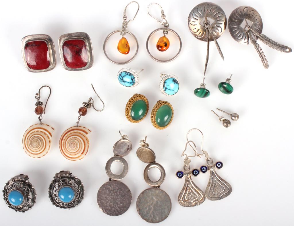 LADIES STERLING SILVER EARRINGS - LOT OF 11: 10125LADIES STERLING SILVER EARRINGS - LOT OF 11 Lot of eleven pairs of sterling silver earrings, varied styles. To include Malachite, Amber, green, blue, and red stones.Weight: 83 gramsWe Can Ship Th