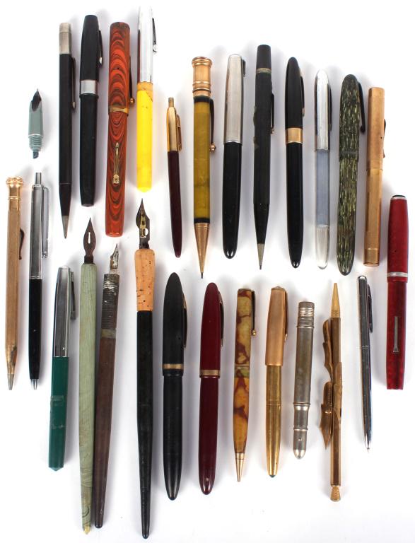 LARGE LOT OF ANTIQUE ASSORTED PENS & PENCILS: 10343LARGE LOT OF ANTIQUE ASSORTED PENS & PENCILS A large mixed lot of 20th century pens and pencils, varied makers and styles. To include Waterman's, Parker, Sheaffer's, Wahl, Venus, and more. Some w