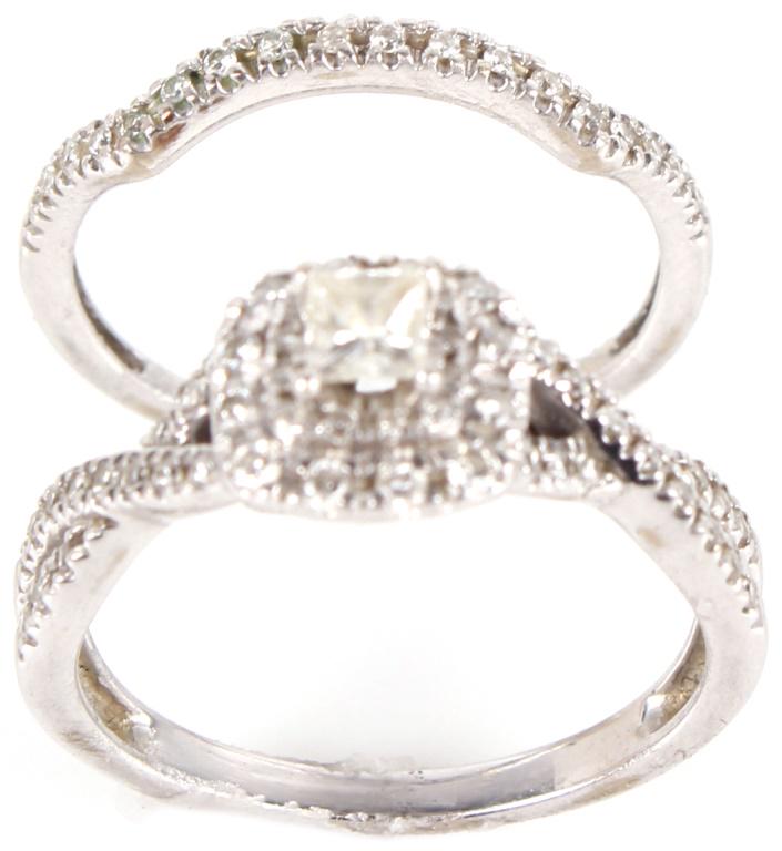 10K WHITE GOLD DIAMOND LADIES BRIDAL RING SET: 1010510K WHITE GOLD DIAMOND LADIES BRIDAL RING SET 10 karat white gold diamond ladies bridal ring set. Engagement ring features an approximately .16 carat square cut diamond, with approximately G colo
