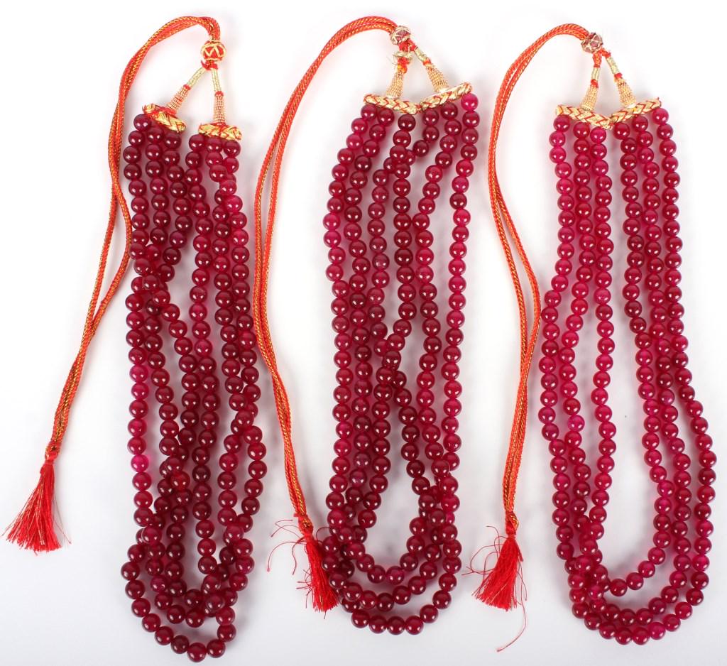 PLUM RED JADEITE BEADED & CHORDED NECKLACES - (3): 10214PLUM RED JADEITE BEADED & CHORDED NECKLACES - (3) Plum red jadeite beaded and woven chord necklaces - lot of 3. Necklaces have an adjustable woven chord. Jade Weight: 391.3 GramsSize: 43" Largest