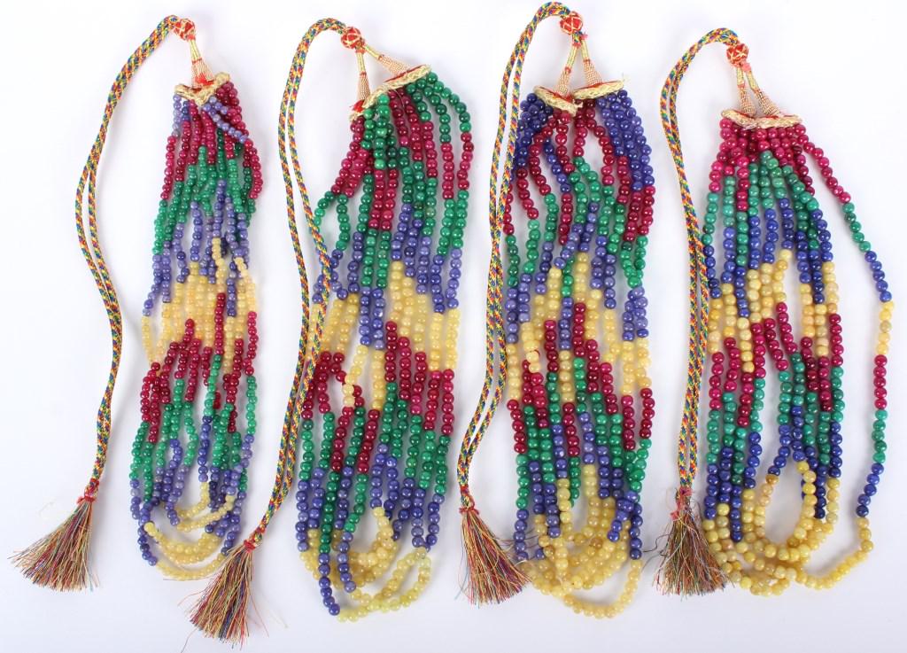 RED GREEN YELLOW & BLUE JADEITE NECKLACES - (4): 10219RED GREEN YELLOW & BLUE JADEITE NECKLACES - (4) Red, green, yellow and blue jadeite beaded and chorded necklaces. Necklaces come with an adjustable woven chord. Jade Weight: 400.5 GramsSize: 44" 