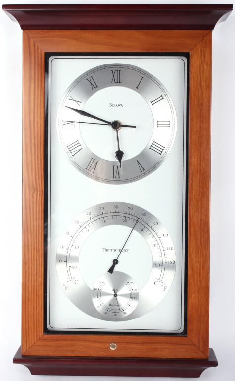 BULOVA WALL-HANGING CLOCK & WEATHER STATION: 10275BULOVA WALL-HANGING CLOCK & WEATHER STATION Bulova wall-hanging clock and weather station. Clock Bulova Unisex Size: 17.5" Tall Condition: Slight damage to mounting area onthe back.