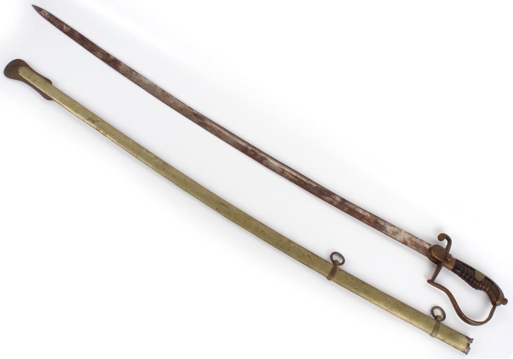 ISLAMIC CURVED SWORD & SCABBARD: 10339ISLAMIC CURVED SWORD & SCABBARD Islamic curved sword and scabbard. Cross Guard features a crescent and star symbol, a classic symbol of Islam. Sword is curved and has a hand guard.Size: Total 36"
