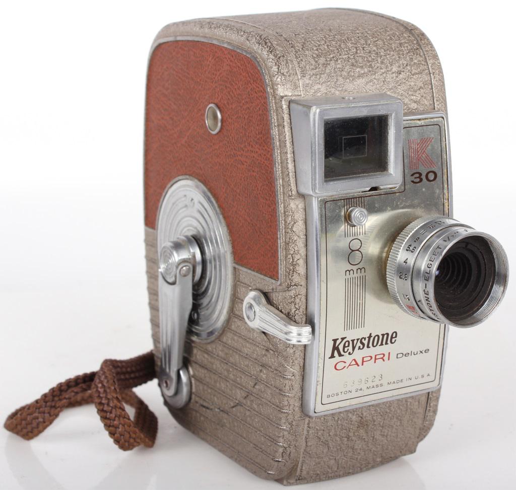 1950'S KEYSTONE CAPRI DELUXE K-30 8MM MOVIE CAMERA: 103621950'S KEYSTONE CAPRI DELUXE K-30 8MM MOVIE CAMERA 1950's Keystone Capri deluxe k-30 8mm movie camera. This vintage movie camera comes fitted with a keystone-elgeet 1/2" f/1.9 lens and film. it h