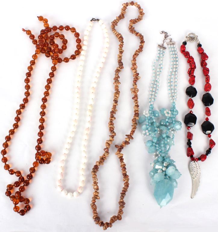 LADIES CUT STONE NECKLACES - LOT OF 5: 10495LADIES CUT STONE NECKLACES - LOT OF 5To include: one with blue stones (sterling clasp), one with clear orange stones, one white with pink coloration (possibly pink coral), one painted red howlite