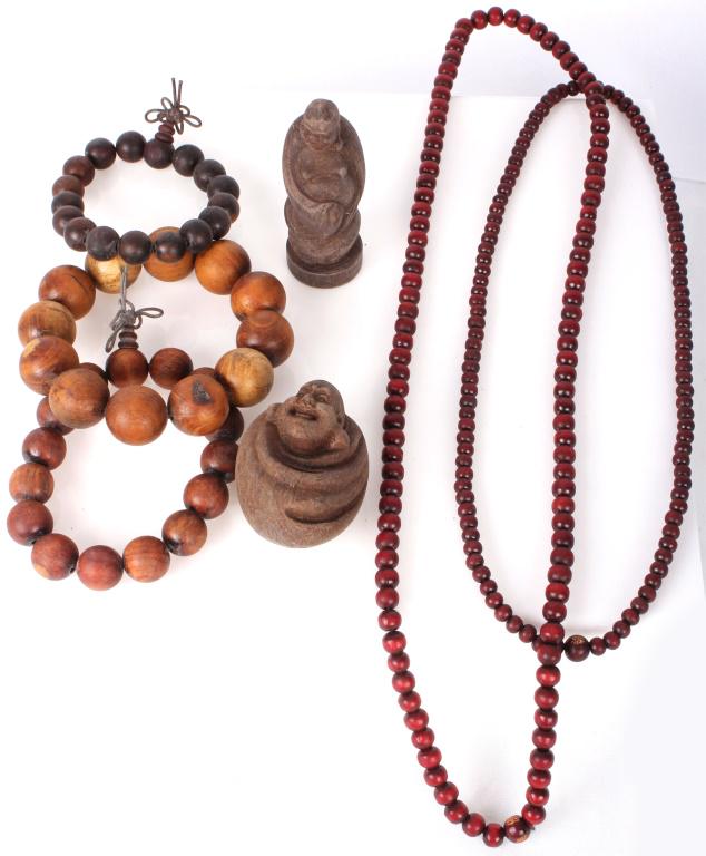 CHINESE CARVED WOOD FIGURINES W/ BEADED JEWELRY: 10642CHINESE CARVED WOOD FIGURINES W/ BEADED JEWELRYChinese wood carved Buddha figurines, 2 wood beaded necklaces, and 3 beaded wood bracelets.28" Longest necklace