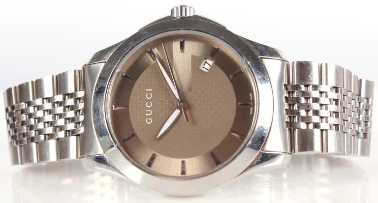 GUCCI G-TIMELESS 126.4 STAINLESS MEN: 10327GUCCI G-TIMELESS 126.4 STAINLESS MEN'S WRISTWATCH Gucci G-Timeless model 126.4 stainless steel luxury dress style men's silver tone analog wristwatch with polished case. Made in Switzerland. Incl