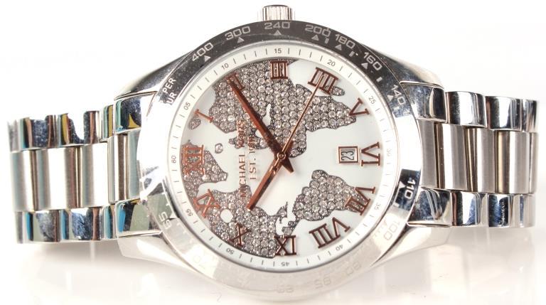 MICHAEL KORS MK5958 LADIES WRISTWATCH WORLD MAP: 10343MICHAEL KORS MK5958 LADIES WRISTWATCH WORLD MAP Michael Kors model MK5958 ladies 45mm wristwatch with Swarovski crystal world map. Rose gold tone hands on white face with silver tone stainless st