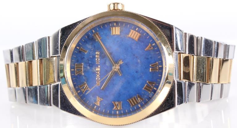 MICHAEL KORS MK5893 LADIES CHANNING WRISTWATCH: 10345MICHAEL KORS MK5893 LADIES CHANNING WRISTWATCH Michael Kors Channing model MK5893 ladies two tone 38mm wristwatch with blue lapis dial. Water resistant to 100 meters. Original box and instruction