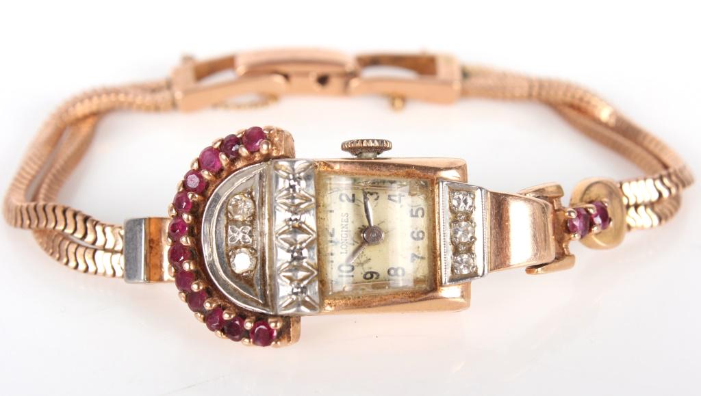 14K ROSE GOLD LONGINES DIAMOND RUBY WRISTWATCH: 1037814K ROSE GOLD LONGINES DIAMOND RUBY WRISTWATCH Longines 14k rose gold diamond ruby vintage ladies wristwatch with fourteen .05ct round rubies and nine .02ct diamonds. Gems and metals tested and v
