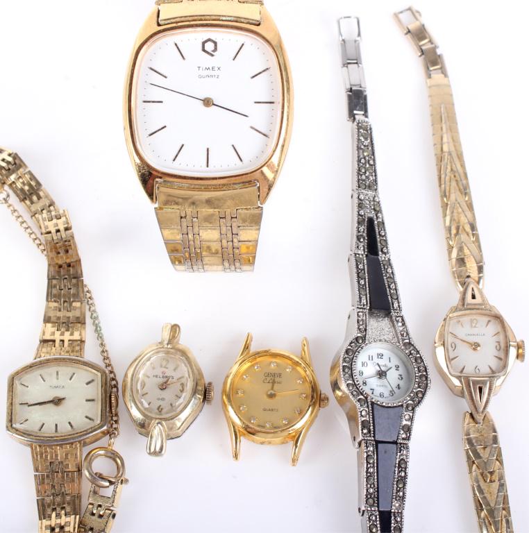 ASSORTED MENS & LADIES WRISTWATCHES - LOT OF 6: 10394ASSORTED MENS & LADIES WRISTWATCHES - LOT OF 6 Assorted mens and ladies wristwatches. Lot to include one mens Timex quartz wristwatch, one ladies Caravelle watch, one Helbros watch, one Geneve cl