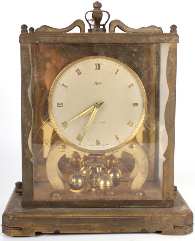 SCHATZ 1000 DAY 9" TALL GERMAN MANTEL CLOCK: 10436SCHATZ 1000 DAY 9" TALL GERMAN MANTEL CLOCK Schatz 1960's 1000 day gold / brass German mantel clock with 2 ruby jewel movement. mantel clock Schatz Size: 8.5" 8.5"
