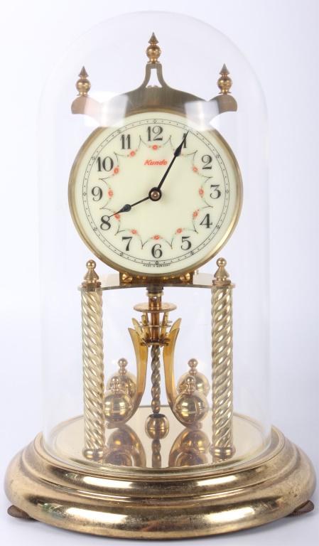 KUNDO GERMAN MANTE CLOCK W/ DOME - WORKING SPRING: 10450KUNDO GERMAN MANTE CLOCK W/ DOME - WORKING SPRING Kundo mantle clock with plastic dome and replaced spring. Made in Germany. mantel clock Kundo Size: 12" 12"