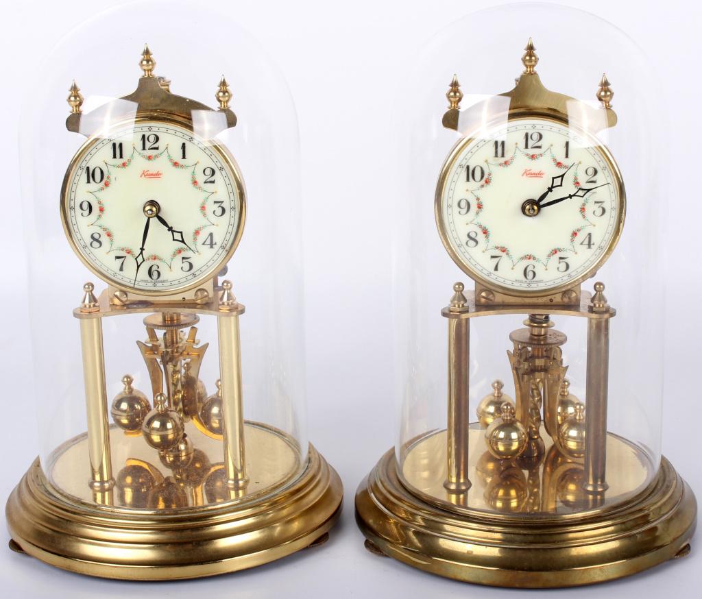 KUNDO GERMAN CREAM FLORAL MANTEL CLOCKS W/ DOME: 10451KUNDO GERMAN CREAM FLORAL MANTEL CLOCKS W/ DOME Kundo German cream floral 10" mantel clocks with glass domes. mantel clock Kundo Size: 10" Condition: Untested. Sold As-Is w/ pieces 10"