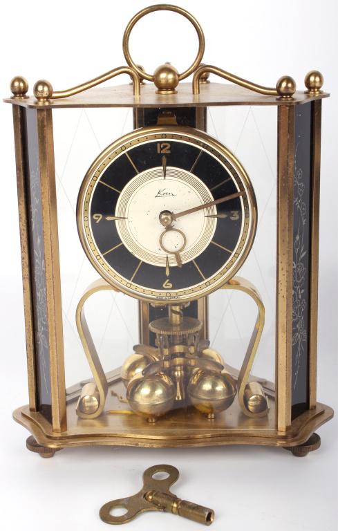 KERN O SOHNE UNADJUSTED ANNIVERSARY MANTEL CLOCK: 10457KERN O SOHNE UNADJUSTED ANNIVERSARY MANTEL CLOCK Vintage Mantel Clock Kern U Sohne Unadjusted Anniversary clock with glass dome. Made in Germany. Includes a winding key and removable glass case. 