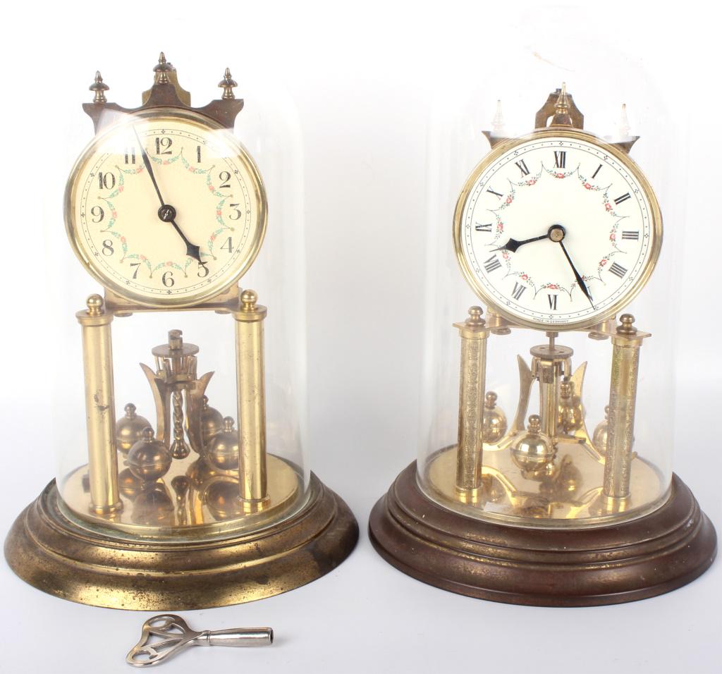 PAIR OF GERMAN DOMED MANTEL CLOCKS: 10467PAIR OF GERMAN DOMED MANTEL CLOCKS Pair of German domed mantel clocks. One marked " 0 Jewels Unadjusted. Plastic domes. mantel clock Size: 12" 12"