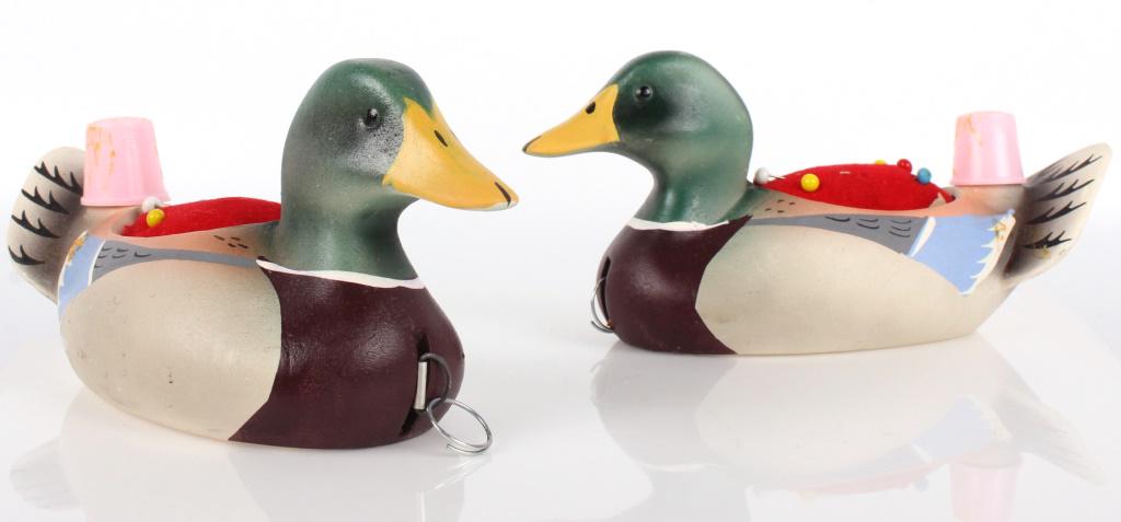 DUCK DECOY PINCUSHION WITH THIMBLE - LOT OF 2: 10922DUCK DECOY PINCUSHION WITH THIMBLE - LOT OF 2 Duck Decoy pincushion with thimble includes two ducks. Condition: Wear commensurate with age.