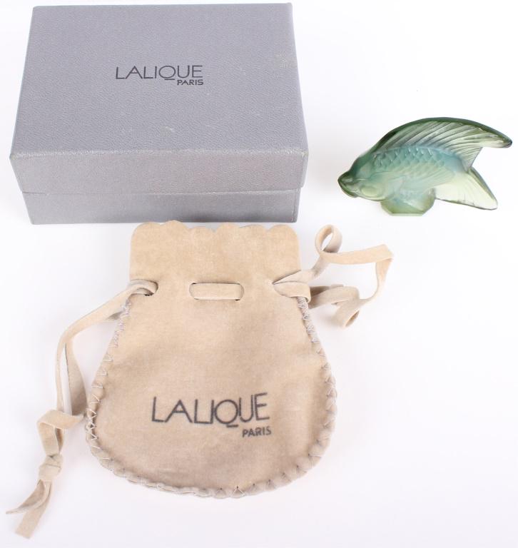 LALIQUE PARIS MINT GREEN FISH CRYSTAL FIGURINE: 10876LALIQUE PARIS MINT GREEN FISH CRYSTAL FIGURINE Lalique Paris mint green fish crystal figurine. Original 1913 design by Rene Lalique. Size: 2 X 2Condition: Very fine. 2 X 2