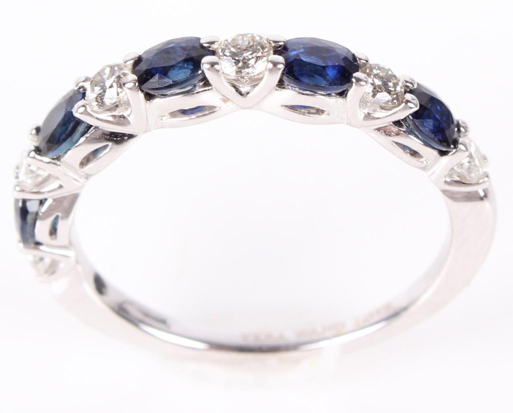 VERA WANG DIAMOND SAPPHIRE WEDDING BAND: 10806VERA WANG DIAMOND SAPPHIRE WEDDING BAND Vera Wang 14k white gold designer wedding band. 0.42 ctw in diamonds and 0.5 ctw in sapphire. Diamond Weight: 3.3 GramsSize: Size: 8.5 Condition: Very fine